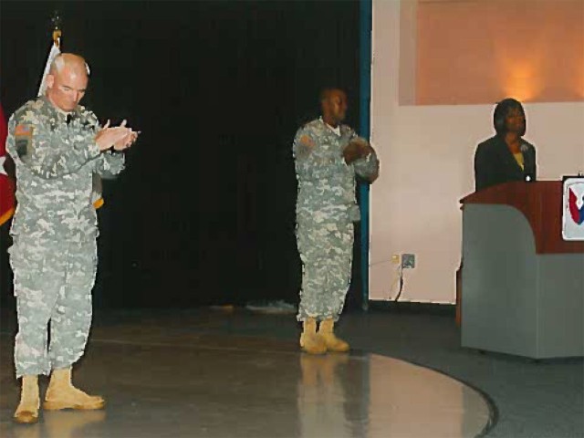 Joyce Allen (Right), Secretary of the General Staff Tank-automotive and Armaments Command, narrates a quarterly awards ceremony in 2009 and provides opening remarks as Maj. Gen. Scott West (Left), then Commanding General TACOM, and Command Sgt....