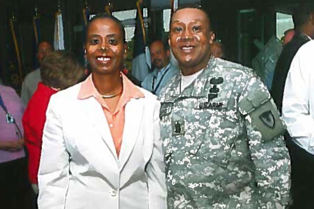 Joyce Allen (Left), Secretary of the General Staff Tank-automotive and Armaments Command, poses for a photo with Command Sgt. Maj. Otis Cuffee, former Command Sgt. Maj. for TACOM, following an awards ceremony in 2006