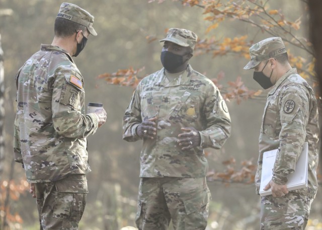 (From left) U.S. Army Command Sgt. Maj. Robert Abernathy, command sergeant major, U.S. Army Europe and Africa, discusses Operation Courageous Ascent, a training exercise designed to test medical operations in austere environments, with U.S. Army Command Sgts. Maj. Fergus Joseph, command sergeant major, Landstuhl Regional Medical Center, and John Contreras, command sergeant major, Troop Command, LRMC, Nov. 18. The exercise tested medical personnel on a variety of combat medical skills such as applying combat action tourniquets, casualty evacuation, dismounted patrolling, land navigation, movement under fire, communications protocol, identifying and reacting to improvised explosive devices and chemical, biological, radioactive and nuclear attacks.