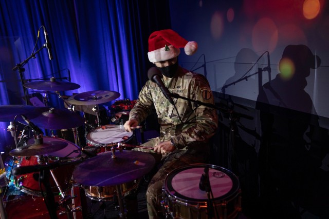 U.S. Army Training and Doctrine Command Band drummer, Sgt. Adam Mendelson rocks out for their virtual holiday show held on Dec. 10, 2020. (U.S. Army photo by Staff Sgt. Osvaldo Corea)