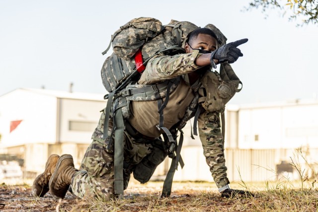 Spc. Devin Jordan, a motor transport operator assigned to Headquarters and Headquarters Company, 83rd Chemical, Biological, Radiological, and Nuclear Battalion, directs his team as cadre called enemy contact during mock Tactical Combat Casualty...