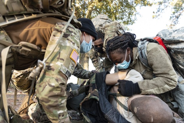 Soldiers from Headquarters and Headquarters Company, 83rd Chemical, Biological, Radiological, and Nuclear Battalion on Fort Stewart Georgia, perform Tactical Combat Casualty Care on a mock casualty, Dec. 10, 2020. The team had to assess the...