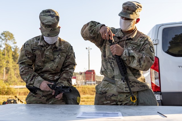 Pvt. Josue Vasallo, a wheeled vehicle mechanic, and Pfc. Willy Calle, a generator mechanic, both assigned to Headquarters and Headquarters Company, 83rd Chemical, Biological, Radiological, and Nuclear Battalion demonstrate their ability to...