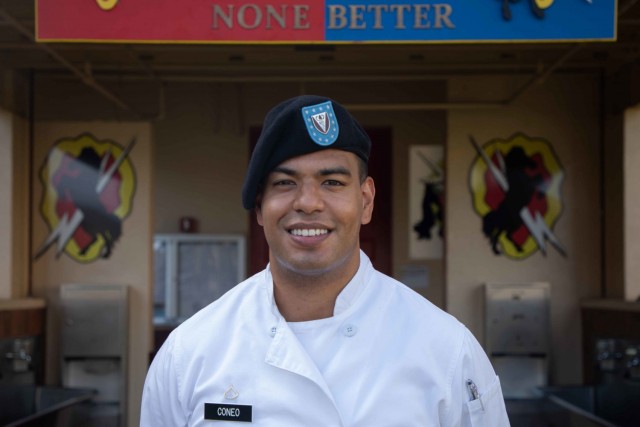 Pfc. George Coneo, a culinary specialist assigned to the 325th Brigade Support Battalion, 3rd Infantry Brigade Combat Team, 25th Infantry Division poses for a photo outside the Bronco Cafe at Schofield Barracks, Hawaii on Dec. 15, 2020. (U.S. Army photo by Staff Sgt. Alan Brutus)