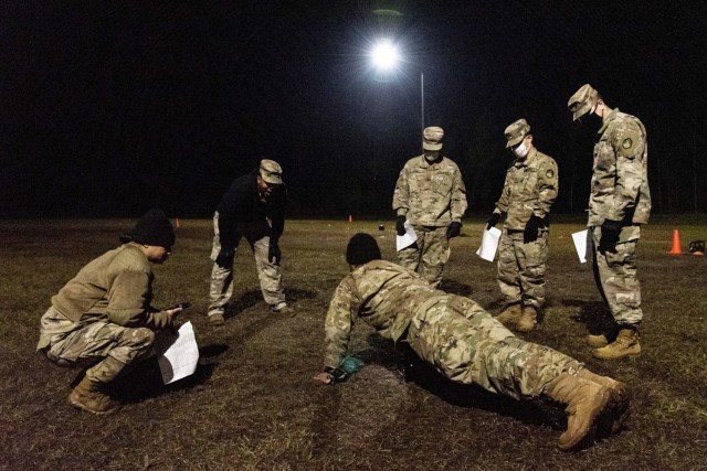 First Sgt. RoRee Anderson, assigned to Headquarters and Headquarters Company, 83rd Chemical, Biological, Radiological, and Nuclear Battalion on Fort Stewart, Georgia, motivates one of his Soldiers during the hand release pushup portion of the Army...