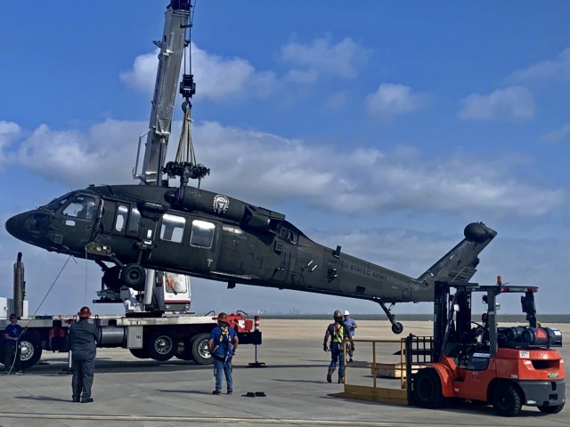 A UH-60L Black Hawk helicopter is prepared for shipment at Corpus Christi Army Depot for an 800-mile journey to Wichita State University where researchers at the National Institute of Aviation Research (NIAR) will create a virtual model of the...