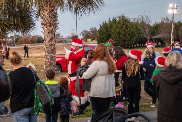 A crowd gathered around Santa Claus after his arrival at Patriots Park during the Fort Jackson annual Holiday Tree Lighting event Dec. 11.