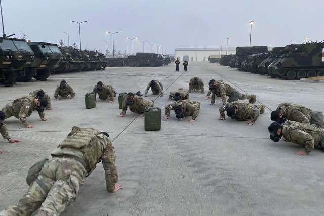 Soldiers assigned to the 2nd Battalion, 7th Infantry Regiment, 1st Armored Brigade Combat Team, 3rd Infantry Division, conduct physical training with their new Korean Augmentations to the U.S. Army, as part of the 2-7IN KATUSA Patching ceremony, November 16, 2020, at Camp Humphreys, Republic of Korea.  U.S. Soldiers and KATUSAs first executed a circuit of exercises while wearing their body armor and M50 Joint Service General Purpose Mask, then held a ceremony to switch the KATUSAs’ former unit patch with the 3ID patch.  This ceremony formally welcomed the KATUSAs into the Cottonbaler Battalion and promoted unity between the Soldiers. (U.S. Army photo by Spc. Keelan Dunn)