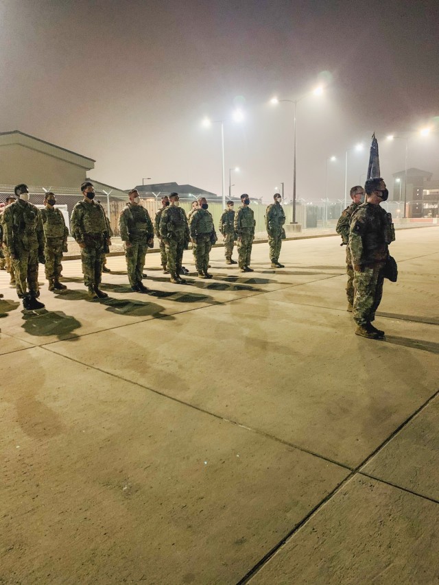 Soldiers assigned to the 2nd Battalion, 7th Infantry Regiment, 1st Armored Brigade Combat Team, 3rd Infantry Division, stand in formation during the 2-7IN Korean Augmentations to the U.S. Army Patching ceremony, November 16, 2020, at Camp Humphreys, Republic of Korea.  U.S. Soldiers and KATUSAs first executed a circuit of exercises while wearing their body armor and M50 Joint Service General Purpose Mask, then held a ceremony to switch the KATUSAs’ former unit patch with the 3ID patch.  This ceremony formally welcomed the KATUSAs into the Cottonbaler battalion and promoted unity between the Soldiers. (U.S. Army photo by 1st Lt. Hope McCraw)