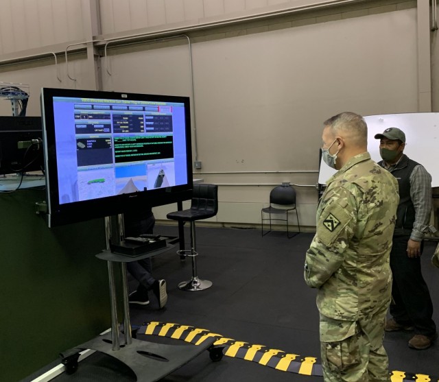 Combined Arms Center-Training Deputy Commander Col. Charles Lombardo checks out the Stryker Virtual Trainers and Virtual Battlespace 3 systems during a recent trip to the Mission Training Complex at Joint Base Lewis-McChord. 