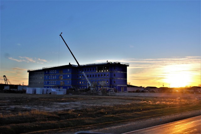 An area of the 1600 block of the cantonment area of the installation is shown Dec. 3, 2020, at sunset as a new multi-million dollar transient troop training barracks is being built at Fort McCoy, Wis. Contractor L.S. Black Constructors was awarded...