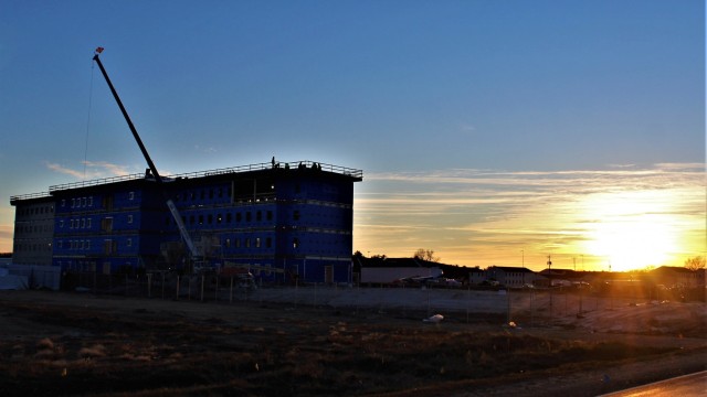 An area of the 1600 block of the cantonment area of the installation is shown Dec. 3, 2020, at sunset as a new multi-million dollar transient troop training barracks is being built at Fort McCoy, Wis. Contractor L.S. Black Constructors was awarded...