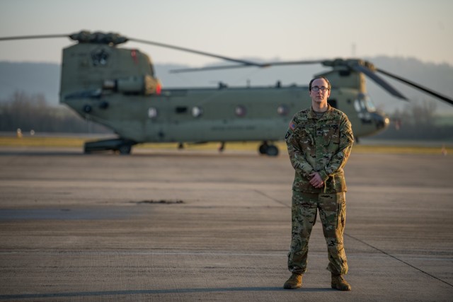 Sgt. Patrick Carter, a CH-47F Chinook flight engineer assigned to B Company, 6th General Support Aviation Battalion, 101st Combat Aviation Brigade, 101st Airborne Division (Air Assault), stands in front of a helicopter at Storck Barracks in Illesheim, Germany, Dec. 16, 2020. Carter, three other flight crew members, and a doctor from the CAB landed in a field to provide medical assistance following a car accident they witnessed while flying back to Illesheim from a routine training mission, Dec. 15, 2020. (U.S. Army National Guard photo by Staff Sgt. Garrett L. Dipuma)