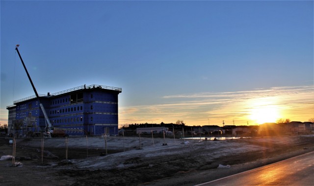 An area of the 1600 block of the cantonment area of the installation is shown Dec. 3, 2020, at sunset as a new multi-million dollar transient troop training barracks is being built at Fort McCoy, Wis. Contractor L.S. Black Constructors was awarded...