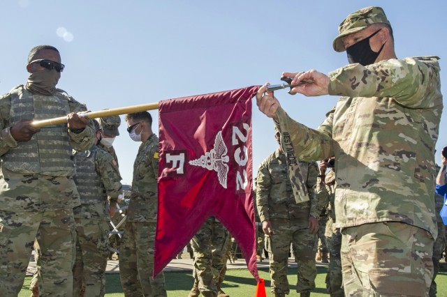 Gen. Paul Funk II, U.S. Army Training and Doctrine Commander presents the Best Advanced Individual Training (AIT) Medic Competition streamer to the winning unit, Foxtrot Company, 232d Medical Battalion at Joint Base San Antonio-Fort Sam Houston,...