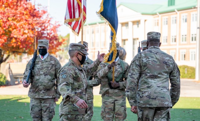 Col. Terry R. Tillis, the commander of the 2nd Armored Brigade Combat Team, 3rd Infantry Division, places the brigade colors back in position during an uncasing ceremony Dec. 18 2020, at Marne Gardens on Fort Stewart, Ga. The ceremony marked the...