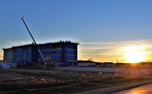 An area of the 1600 block of the cantonment area of the installation is shown Dec. 3, 2020, at sunset as a new multi-million dollar transient troop training barracks is being built at Fort McCoy, Wis. Contractor L.S. Black Constructors was awarded...
