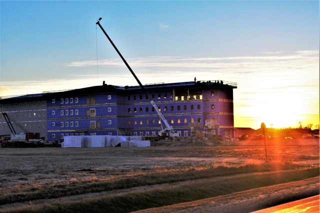 An area of the 1600 block of the cantonment area of the installation is shown Dec. 3, 2020, at sunset as a new multi-million dollar transient troop training barracks is being built at Fort McCoy, Wis. Contractor L.S. Black Constructors was awarded...