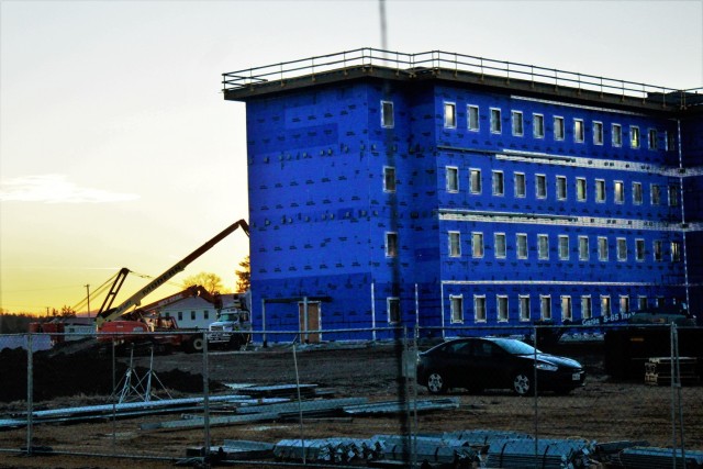 An area of the 1600 block of the cantonment area of the installation is shown Dec. 10, 2020, at sunrise as a new multi-million dollar barracks is being built at Fort McCoy, Wis. Contractor L.S. Black Constructors was awarded a $20.6 million contract to build the barracks in September 2019. The planned completion date is currently August 2021. The planned barracks will be different than the traditional barracks that are located throughout the installation. This new building is four stories and be able to house 400 people in approximately 60,000 square feet. The project also is the first of eight new buildings planned for the entire 1600 block at Fort McCoy. The plan is to build three more barracks with the same specifications, three 20,000-square-foot brigade headquarters buildings, and one 160-room officer quarters. This is an Army Corps of Engineers-managed project. (U.S. Army Photo by Scott T. Sturkol, Public Affairs Office, Fort McCoy, Wis.)