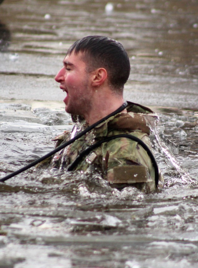 A Fort McCoy Cold-Weather Operations Course (CWOC) Class 21-01 student participates in cold-water immersion training Dec. 15, 2020, at Big Sandy Lake on South Post at Fort McCoy, Wis. CWOC students are trained on a variety of cold-weather...