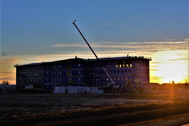 An area of the 1600 block of the cantonment area of the installation is shown Dec. 3, 2020, at sunset as a new multi-million dollar transient troop training barracks is being built at Fort McCoy, Wis. Contractor L.S. Black Constructors was awarded...
