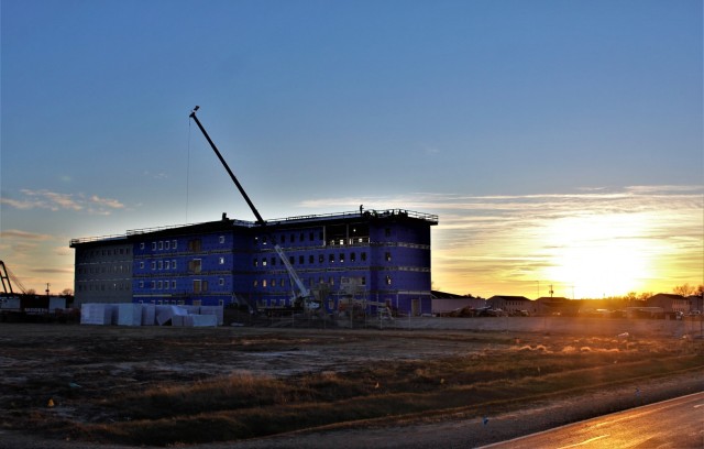 An area of the 1600 block of the cantonment area of the installation is shown Dec. 3, 2020, at sunset as a new multi-million dollar transient troop training barracks is being built at Fort McCoy, Wis. Contractor L.S. Black Constructors was awarded...