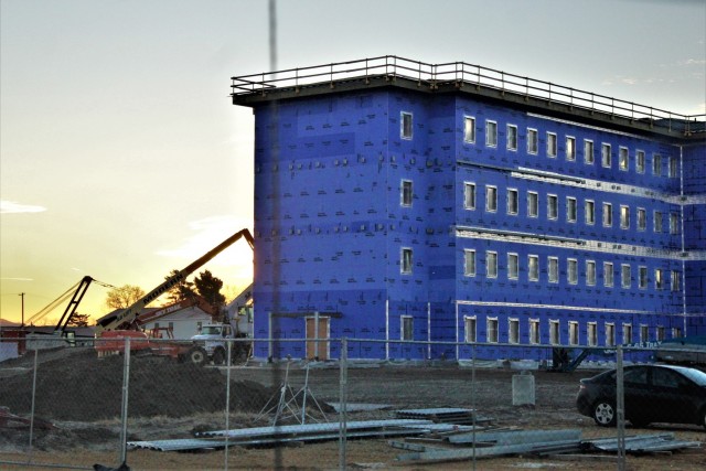 An area of the 1600 block of the cantonment area of the installation is shown Dec. 10, 2020, at sunrise as a new multi-million dollar barracks is being built at Fort McCoy, Wis. Contractor L.S. Black Constructors was awarded a $20.6 million contract to build the barracks in September 2019. The planned completion date is currently August 2021. The planned barracks will be different than the traditional barracks that are located throughout the installation. This new building is four stories and be able to house 400 people in approximately 60,000 square feet. The project also is the first of eight new buildings planned for the entire 1600 block at Fort McCoy. The plan is to build three more barracks with the same specifications, three 20,000-square-foot brigade headquarters buildings, and one 160-room officer quarters. This is an Army Corps of Engineers-managed project. (U.S. Army Photo by Scott T. Sturkol, Public Affairs Office, Fort McCoy, Wis.)