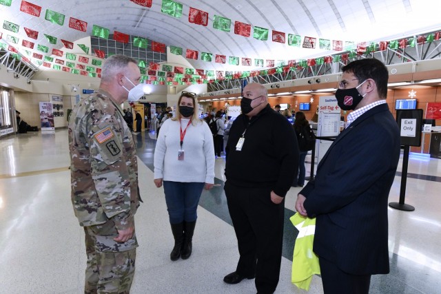 Maj. Gen. Dennis LeMaster, U.S. Army Medical Center of Excellence Commanding General (left) thanks San Antonio International Airport Executives for the tremendous support shown by all airport employees and volunteers during Holiday Block Leave on December 19, 2020. (Pictured left to right: Maj. Gen. Dennis LeMaster, Jennifer Pysher, Jesus Saenz and Syed Mehdi.)
