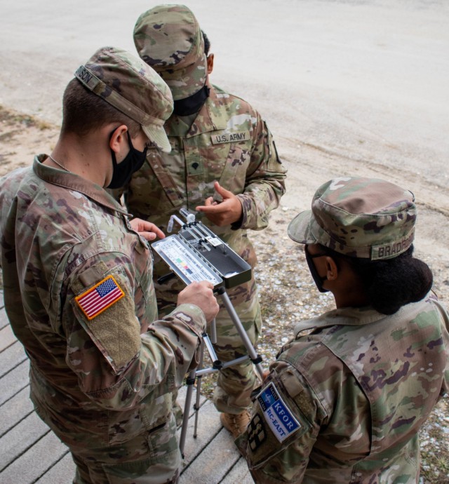 U.S. Army Soldiers assigned to the 566th Medical Company (Area Support) based in Fort Hood, Texas, demonstrate the use of a wet bulb globe temperature index calculator during a field sanitation class at Camp Bondsteel, Kosovo, on Dec. 17, 2020....