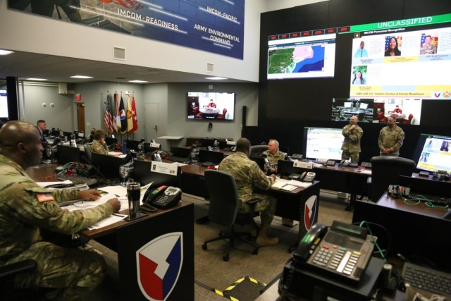 Gen. Edward Daly, Commanding General of Army Materiel Command, and Cmd. Sgt. Maj. Alberto Delgado, AMC’s senior enlisted leader, address Lt. Gen. Douglas M. Gabram, Commanding General of U.S. Army Installation Management Command and other leaders in the IMCOM Operations Center Dec. 17, 2020. 