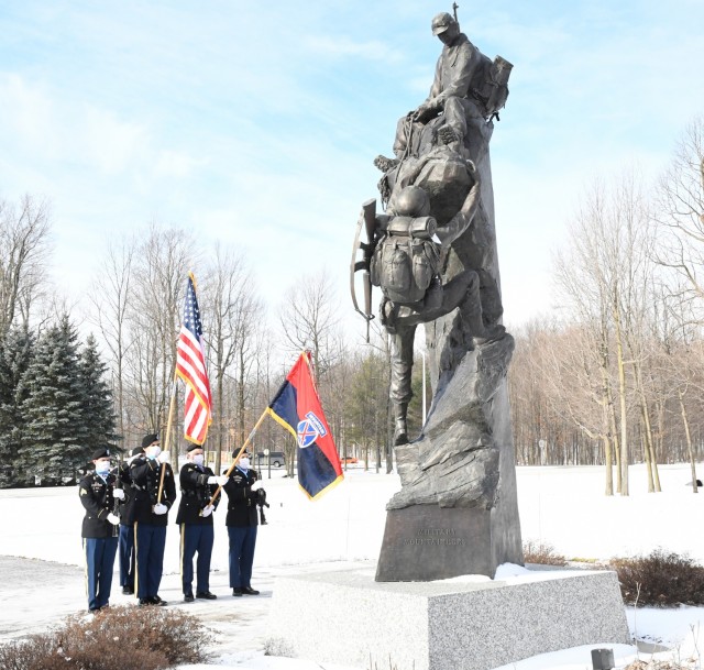 A color guard from 2nd Battalion, 15th Field Artillery Regiment, 2nd Brigade Combat Team, supports the National Wreaths Across America Day event Dec. 19 in Memorial Park with Fort Drum Scouts. (Photo by Mike Strasser, Fort Drum Garrison Public...