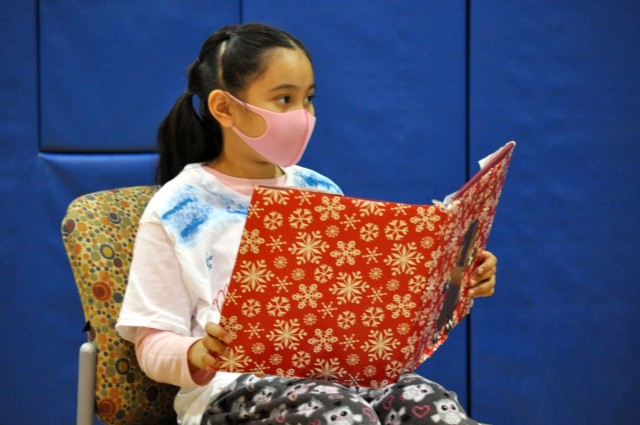 Leila Kaea, 9, narrates the holiday play at the School Age Center at Sagamihara Family Housing Area, Japan, Dec. 18.