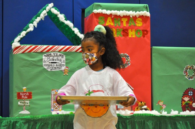 Mia Stewart, 7, plays Mrs. Claus during the holiday play at the School Age Center at Sagamihara Family Housing Area, Japan, Dec. 18.