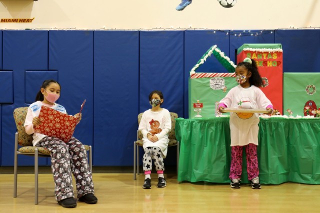 From left, Leila Kaea, 9, Andrea Crispell, 9, and Mia Stewart, 7, perform in the holiday play at the School Age Center at Sagamihara Family Housing Area, Japan, Dec. 18.