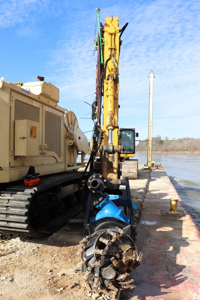 A Kansas City District track-hoe on a barge work boat took part in hydrodynamic dredging operations on the Missouri River November 11, 2020. The hydrodynamic dredge head is mounted on the bucket and the arm directs the flow the desired area of...