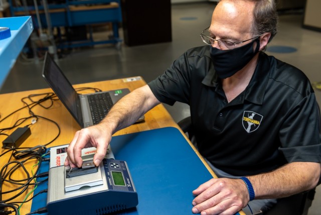 Using a universal device programmer, Mark Sgobba is shown reading, writing and verifying Volcano microprocessor(CPU) firmware for a newly fabricated Volcano CPU CCA.