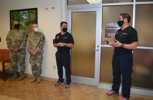 Air Force Lt. Col. Matthew R. Schmitz, Chair of the Department of Orthapaedics at Brooke Army Medical Center talks during the Dec. 16 ribbon cutting ceremony for the Musculoskeletal Integrated Practice Unit at the Jennifer Moreno Clinic on Joint Base San Antonio Fort Sam Houston while Brig. Gen. Shan Bagby, the commanding General for BAMC; Air Force Col. Patrick Osborn,  Deputy Commander for Surgical Services at BAMC; and Air Force Maj. Gen John DeGoes, the Chief Executive Officer for the San Antonio Military Health System, listen. The MSK IPU is a one-stop shop for active duty service members and beneficiary patients who come in with a variety of musculoskeletal issues. 
(U.S. Army photo by Daniel J. Calderón)