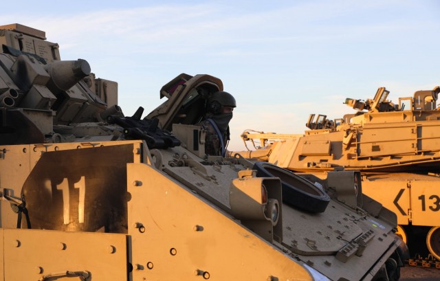 CONSTANTA, Romania – As the sun starts to set over the Black Sea, a driver moves his vehicle toward the ramp of a nearby ship. 80 Soldiers from 3rd Battalion, 15th Infantry Regiment out of Fort Stewart, Ga. loaded 260 vehicles and shipping containers in 12 hours here on Nov. 23 in what was the final step of a month-long process of the redeployment of equipment and troops back to their home station. (U.S. Army Photo by Sgt. H. Marcus McGill)