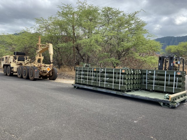 After the containers of ammunition arrive at Lualualei, they are unloaded and inventoried. The contents are then moved to a palletized load system flat rack and moved to the bunker where the ammunition will ultimately be stored.