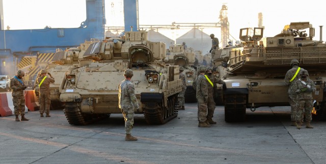 CONSTANTA, Romania – Vehicles are staged for loading aboard a nearby ship. 80 Soldiers from 3rd Battalion, 15th Infantry Regiment out of Fort Stewart, Ga. loaded 260 vehicles and shipping containers in 12 hours here on Nov. 23 in what was the final step of a month-long process of the redeployment of equipment and troops back to their home station. (U.S. Army Photo by Sgt. H. Marcus McGill)