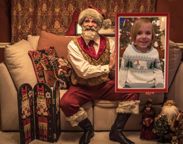 Todd Bishop, a U.S. Army Medical Materiel Agency civilian employee, is pictured as “Santa Todd,” with Evan Miller, a youngster from Homer, Ala. The virtual photo with Santa is one way Bishop has adapted to distancing requirements during the COVID-19 pandemic.