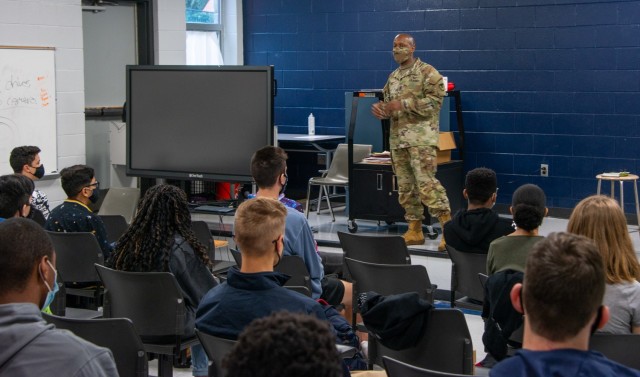 Command Sgt. Maj. Sean Rice, from U.S. Army Security Assistance Command at Redstone Arsenal, speaks to the JROTC class at Bob Jones High School, 12 Nov., in Huntsville, AL. Command Sgt. Maj. Rice amused the students with stories from his time with...