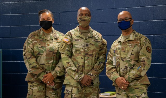 Command Sgt. Maj. Sean Rice, center, from U.S. Army Security Assistance Command at Redstone Arsenal, poses with Maj. Melissa Lacey, left, and Chief Master Sgt. Ellis Clark, right, both instructors for the JROTC class at Bob Jones High School, 12...