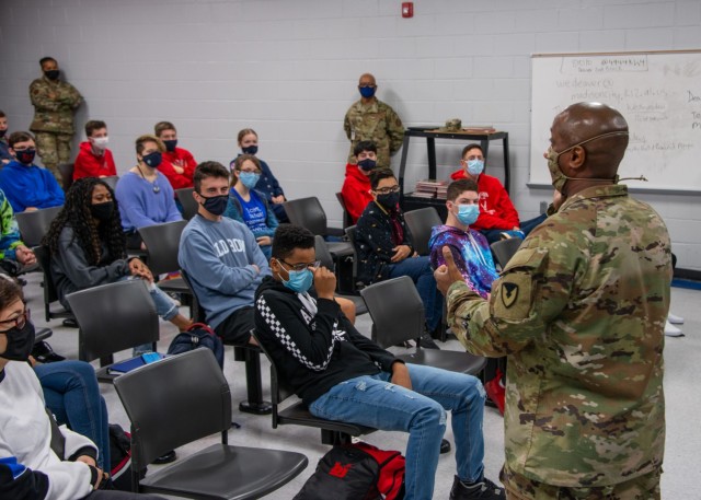 Command Sgt. Maj. Sean Rice, from U.S. Army Security Assistance Command at Redstone Arsenal, speaks to the JROTC class at Bob Jones High School, 12 Nov., in Huntsville, AL. Command Sgt. Maj. Rice amused the students with stories from his time with...