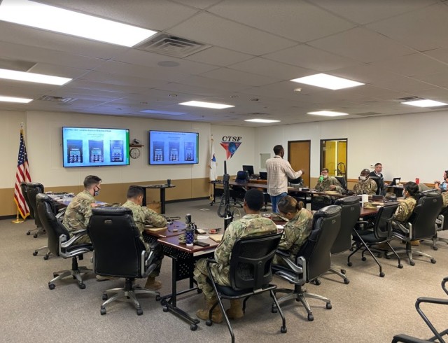 Fort Hood, Texas -Hand-Held, Manpack, and Small Form Fit (HMS) instructor Ezra Rodriguez provides training for Soldiers on setup and configuration of the HMS radios at the Central Technical Support Facility.