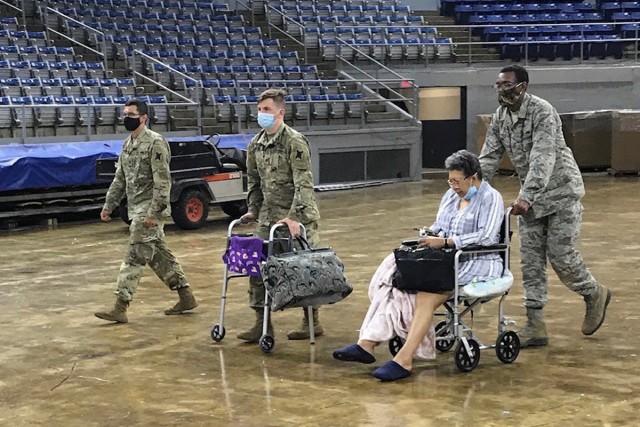 Louisiana National Guard Soldiers and Airmen assist evacuating citizens in southwest Louisiana prior to the landfall of Hurricane Laura at the Burton Coliseum in Lake Charles, Louisiana, Aug. 26, 2020. Burton Coliseum is being used as a transition...