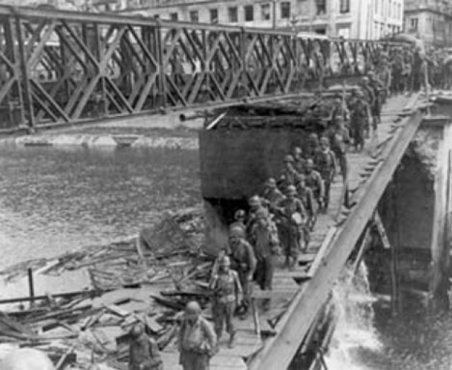 Soldiers of the 30th Infantry, 3rd Division cross the Doubs River in France in 1944.
