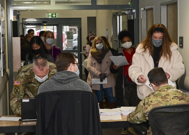 U.S. Army Garrison Stuttgart community members line up to receive the COVID-19 vaccine at Patch Barracks on Thursday, Dec. 31, 2020.