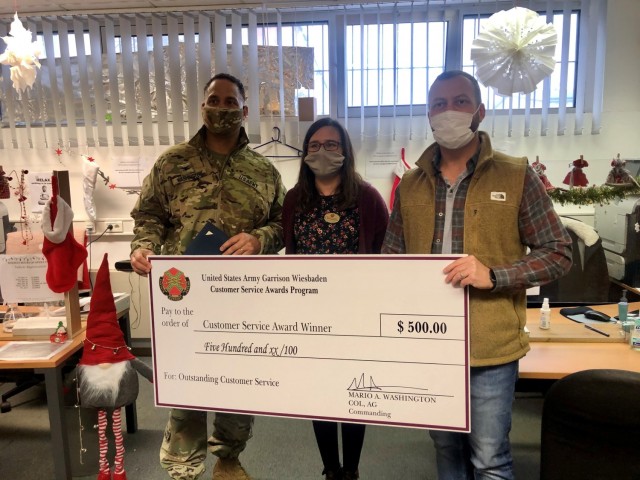 WIESBADEN, Germany – Doris Roschmann, vehicle registration clerk, receives her customer service award Dec. 18, 2020 at her U.S. Army Garrison Wiesbaden workplace. Photo by Brittany Casey.