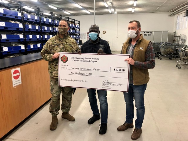 WIESBADEN, Germany – Kokou Nelitche, supply technician for the Logistics Readiness Center, receives his customer service award Dec. 18, 2020 at his U.S. Army Garrison Wiesbaden workplace. Photo by Brittany Casey.